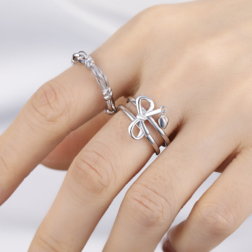 Adjustable double band ring with knot and heart charms in 925 sterling silver 